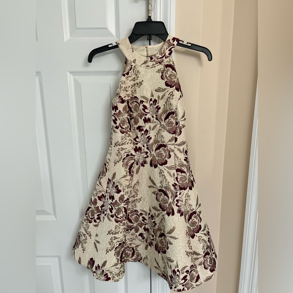 Stunning backless fit and flare dress with shades of gold and maroon